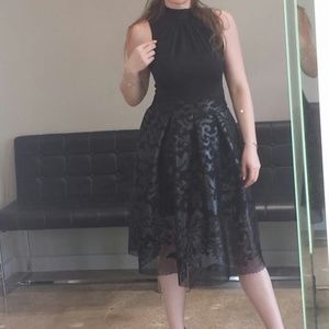 Brand name black dress with leather bottom, wear only ones. excellent condition.